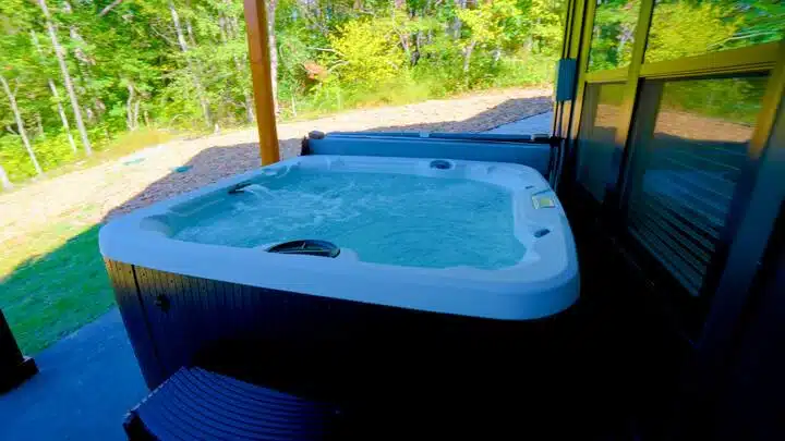 Enjoy the wooded scenary with a soak in the 7 person hot tub